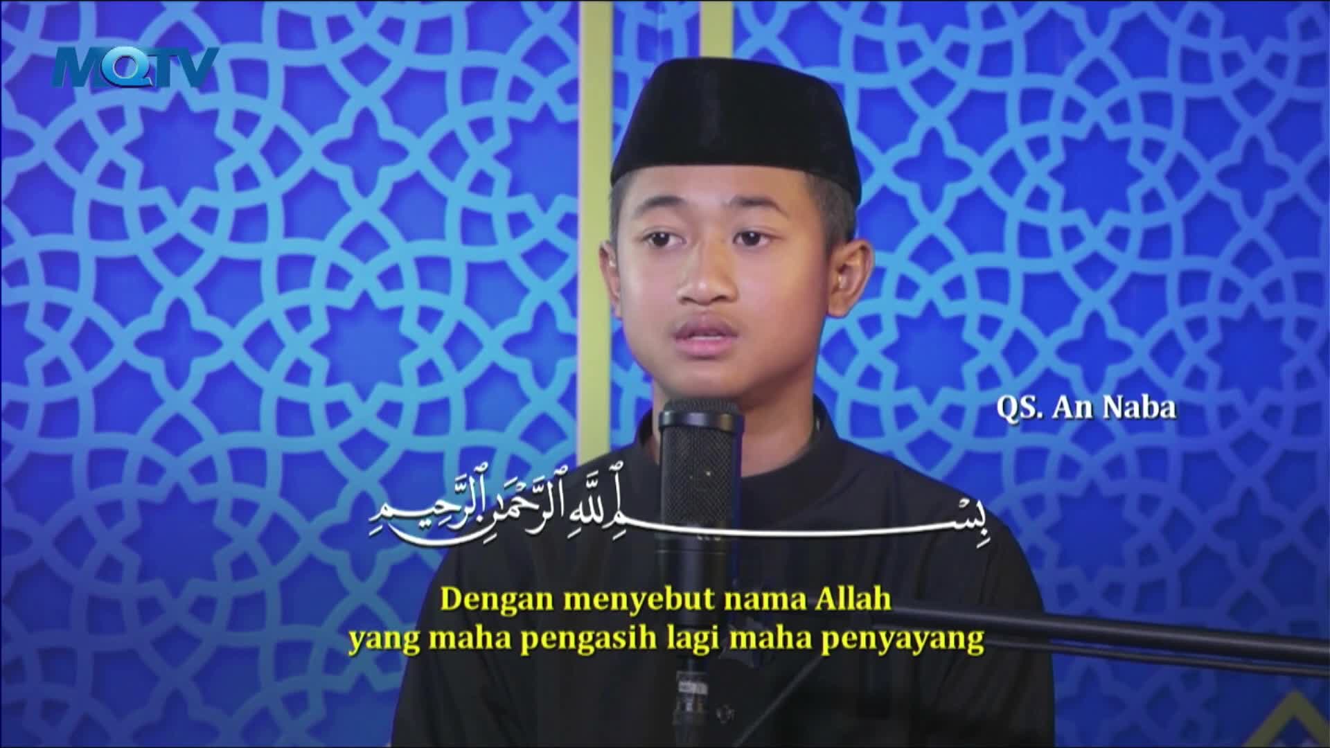 A young man, wearing a black cap, speaks into a microphone against a patterned blue backdrop, likely for MQTV in Indonesia. Below the Arabic script, the translation appears, "With the name of Allah, the Most Gracious, the Most Merciful."
