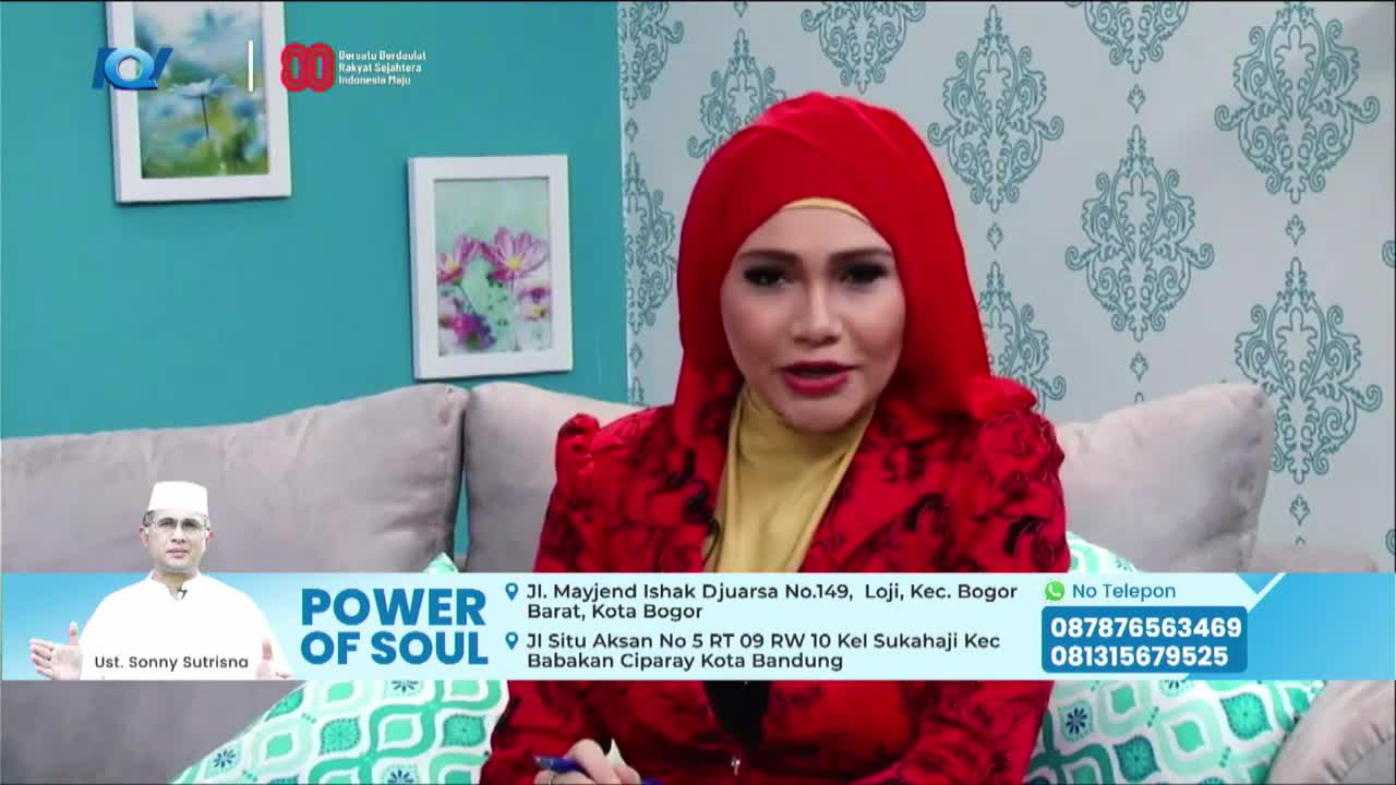 A woman in a bright red headscarf and jacket speaks directly to the camera. Below her, a lower-third graphic advertises "Power of Soul" with contact information and a picture of a man.
