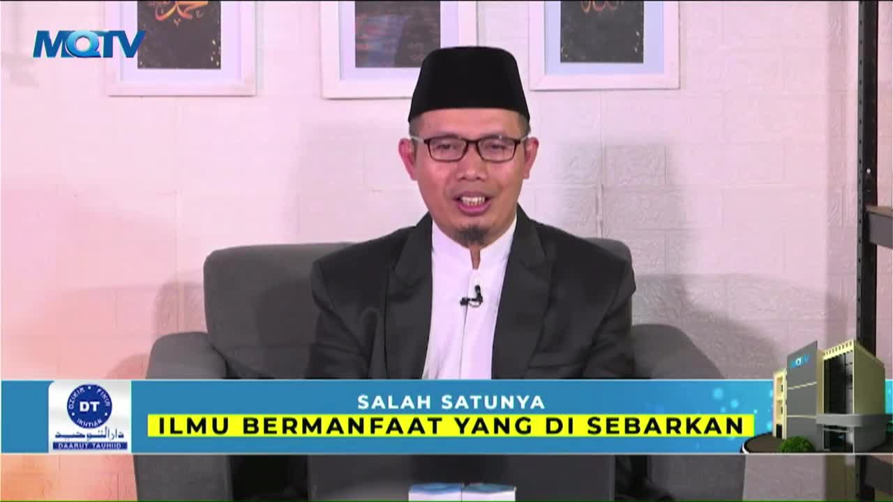 A man in a black cap and glasses is speaking, his mouth open in mid-sentence on the MQTV set. The lower third of the screen displays text in Indonesian, with the channel's logo in the corner.
