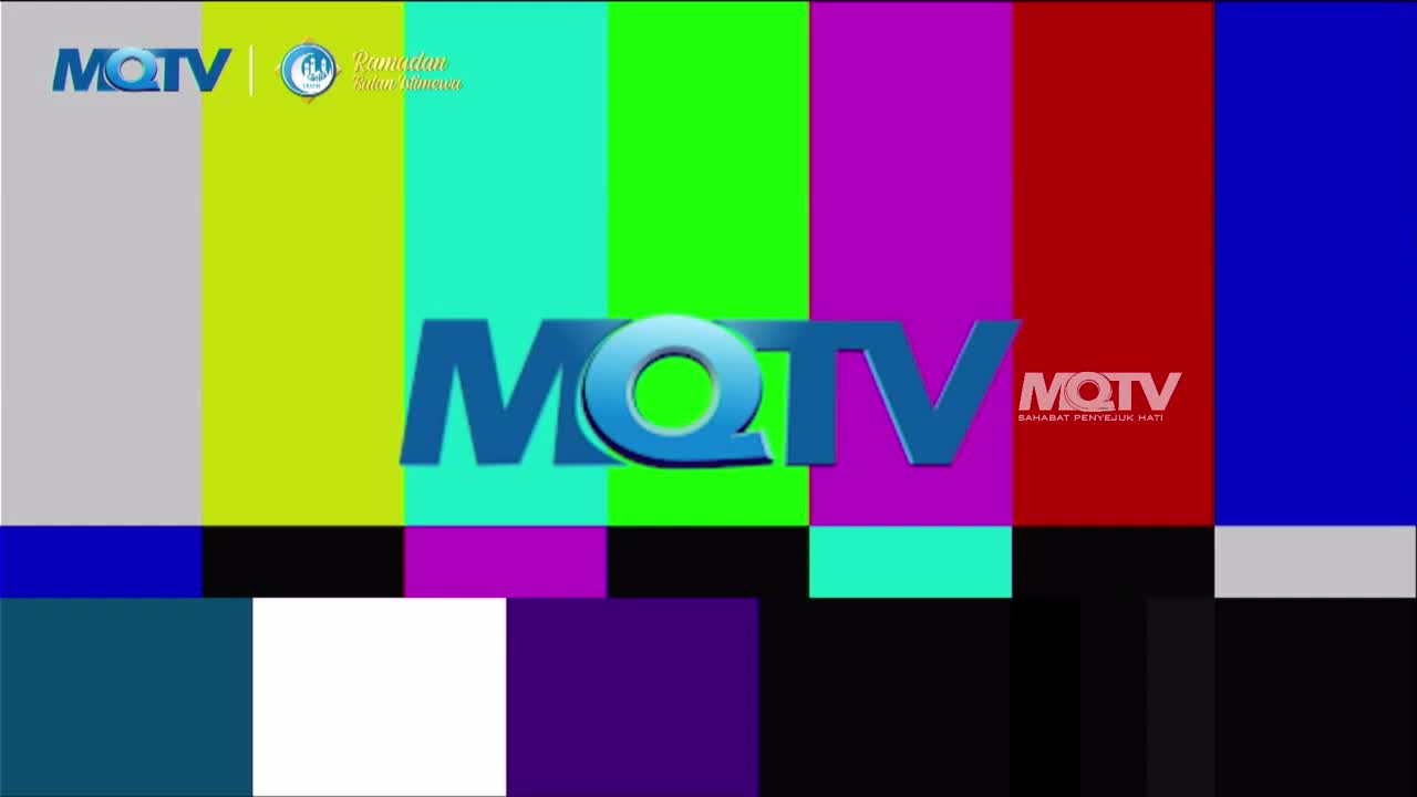 The screen displays a test pattern with vertical bars of gray, lime green, turquoise, magenta, red, and blue. The MQTV logo, a stylized blue "MQTV," appears prominently in the center, with a smaller version of the logo and the tagline "SAHABAT PENYEJUK HATI" on the red bar.