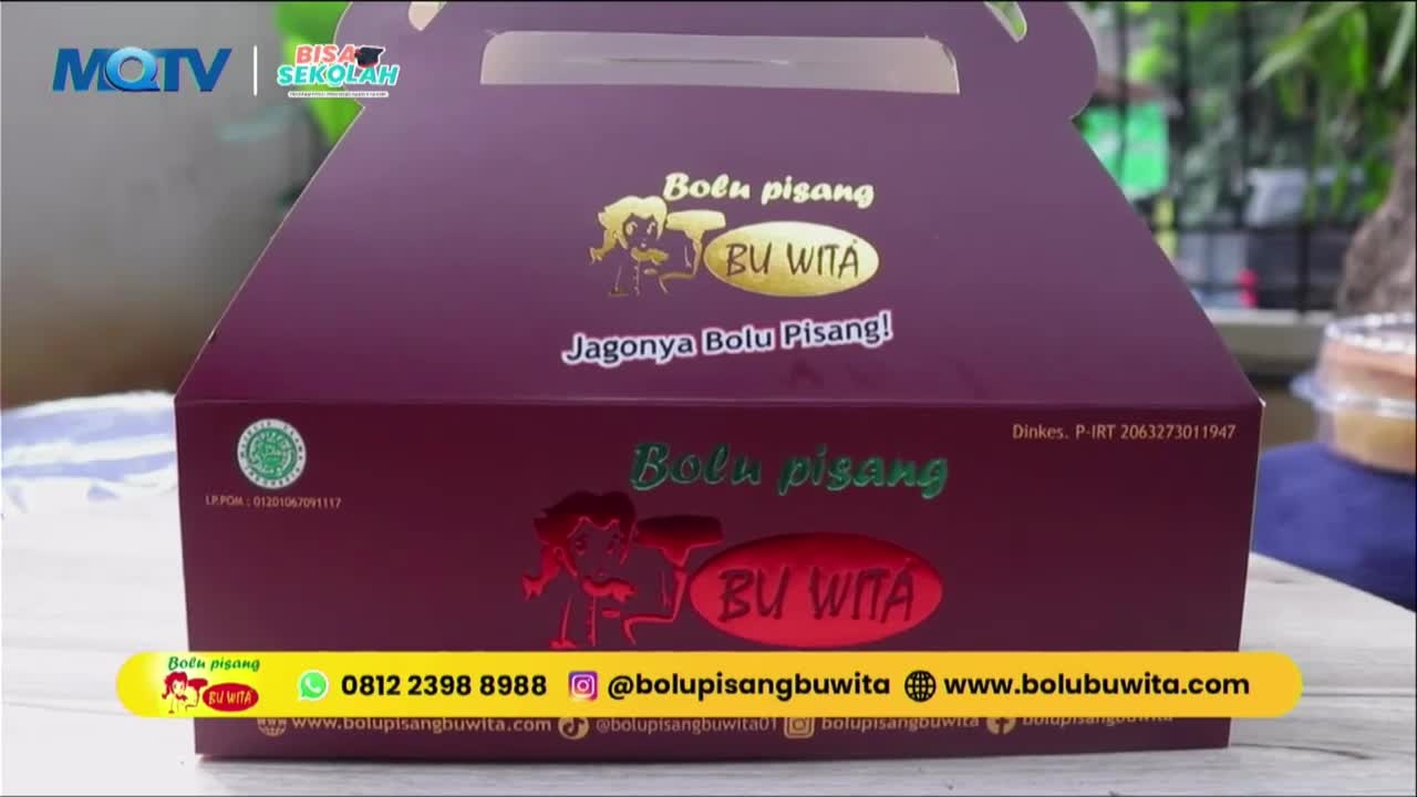 A deep purple box for "Bolu Pisang BU WITA" sits on a table. A bright yellow banner at the bottom displays contact information and social media handles.