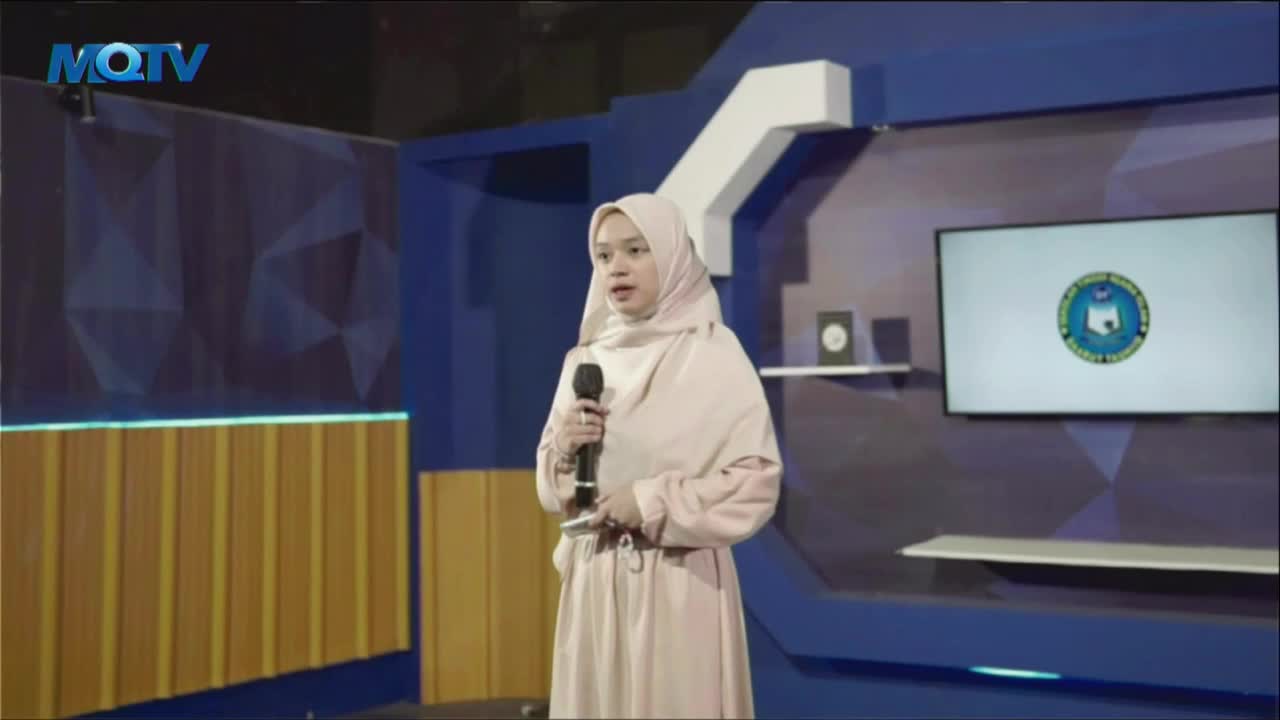 A young woman in a light pink hijab speaks into a microphone on a stage. The MQTV logo is visible in the upper left corner of the screen.