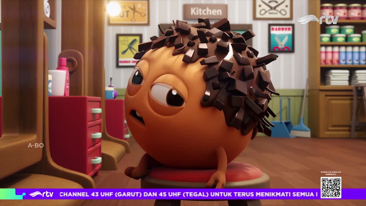 A round, orange character with dark, angular hair sits on a stool, looking worried. The scene is a cartoon barber shop, likely from an Indonesian Rajawali TV broadcast.
