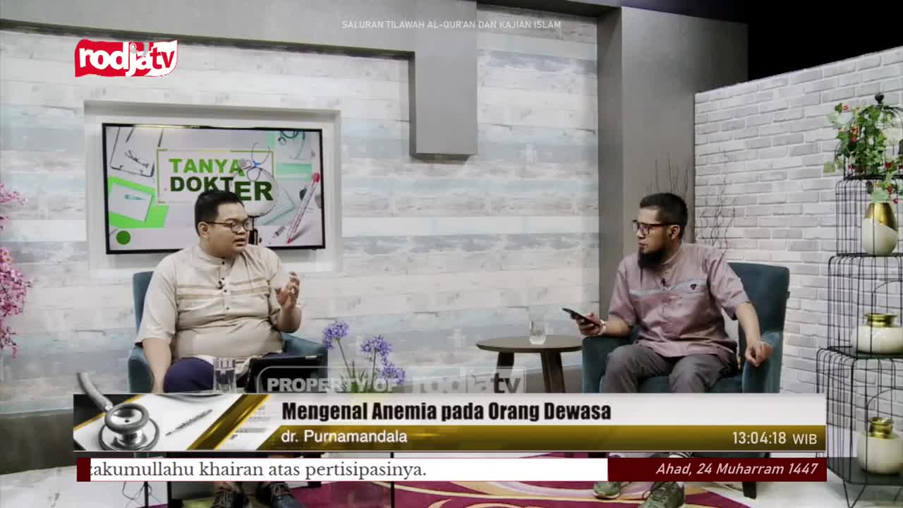 On Rodja TV, a doctor gestures with his hands, explaining something to the other man, who holds a phone. The graphic on the screen says "Tanya Dokter" and the topic is "Mengenal Anemia pada Orang Dewasa."

