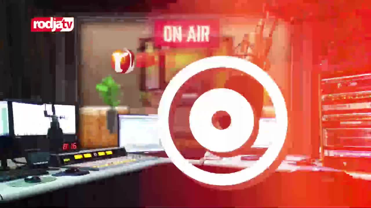 A studio control panel glows with lights and numbers. The "ON AIR" sign is lit, while a Rodja TV logo floats nearby.
