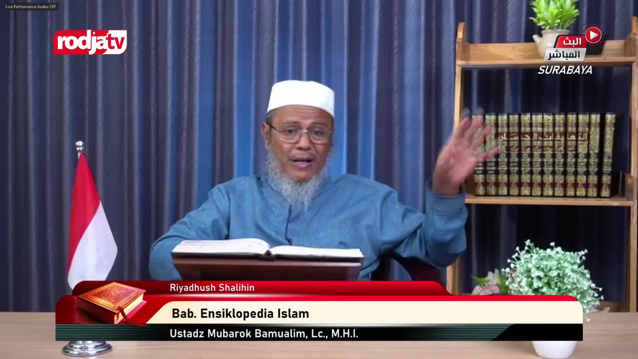 On Rodja TV, a man in a white cap gestures with his right hand while speaking. The Indonesian flag stands to his left, and a graphic identifies the program's topic.
