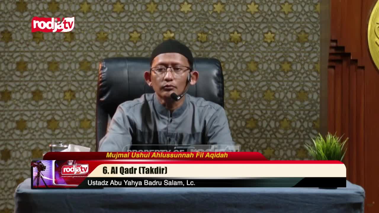 A man in glasses and a black cap sits behind a desk, speaking into a microphone. The Rodja TV logo is visible in the corner, and a lower third banner identifies the topic as "Al Qadr."
