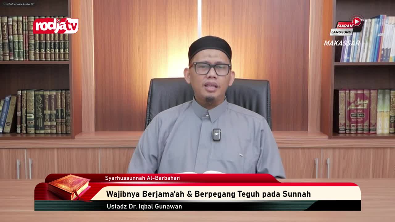 A man in a black cap and glasses speaks directly to the camera, his hands gesturing slightly. The Rodja TV logo is visible, and a banner below him displays the title of his talk in Indonesian.
