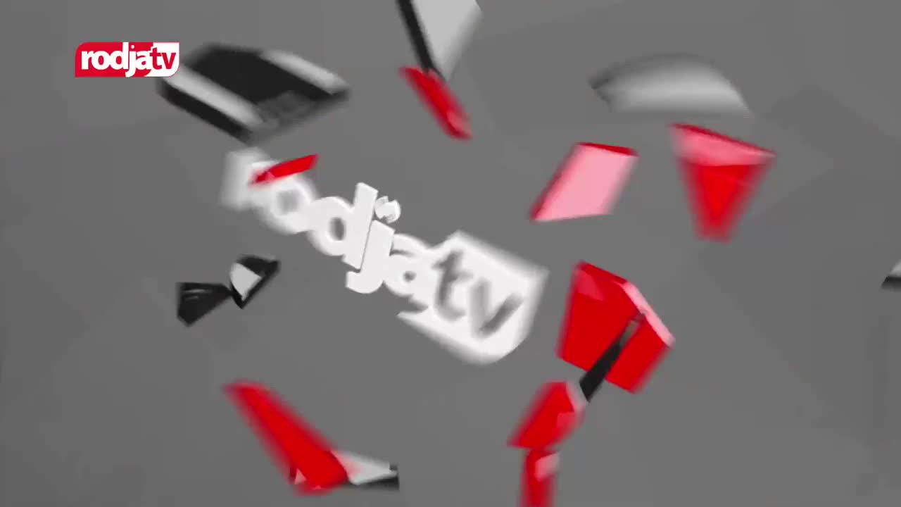 The "rodjatv" logo tumbles through the air, its white letters blurring against a gray background. Sharp, red and black geometric shapes also scatter and spin around it. The "rodjatv" logo tumbles through the air, its white letters blurring against a gray background. Sharp, red and black geometric shapes also scatter and spin around it.