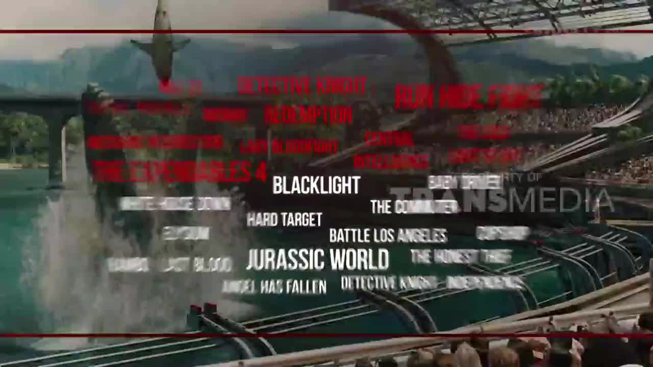 A shark leaps from the water, above a list of movie titles, all part of a Trans TV Indonesia promo. The scene is set in a stadium, with a crowd visible in the background.
