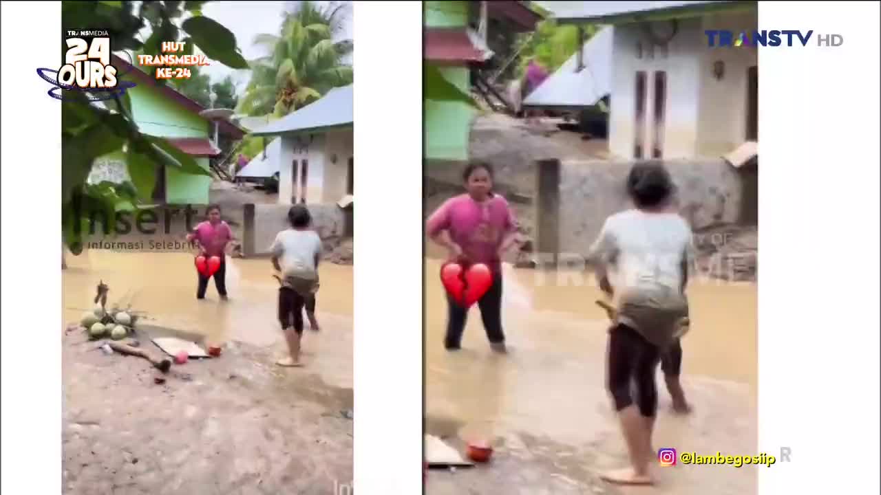 The water is high, and two people are standing in it, with a woman in a pink shirt and a boy in a white one. A red heart graphic is superimposed on the image, and a Trans TV logo is visible.
The water is high, and two people are standing in it, with a woman in a pink shirt and a boy in a white one. A red heart graphic is superimposed on the image, and a Trans TV logo is visible.