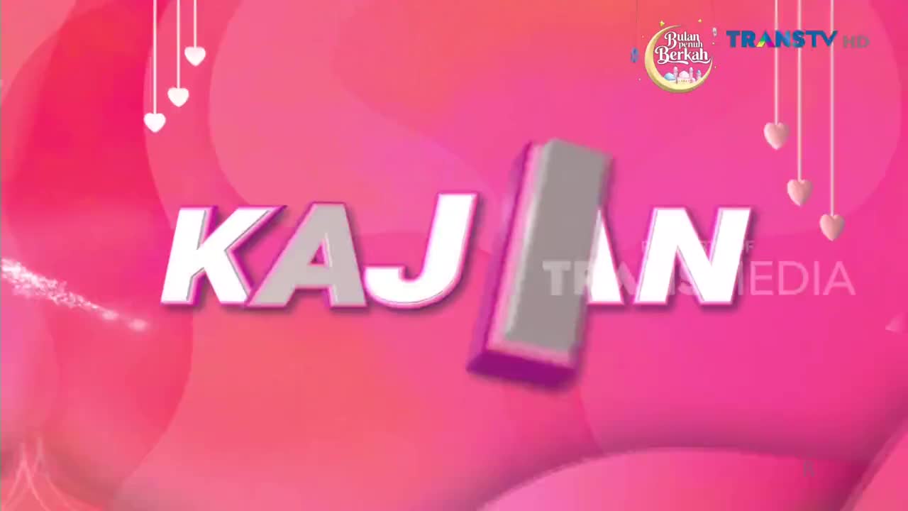 The letters "KAJ" drift across the screen, followed by a gray, rectangular shape that obscures the "AN." Trans TV's logo appears at the top right, next to a crescent moon graphic.