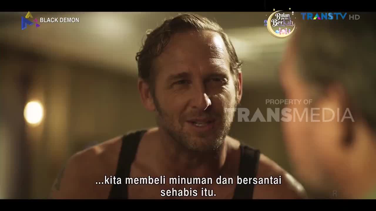 A man with a stubbled jaw speaks, his eyes focused on someone just out of frame. The Trans TV logo is visible in the background.