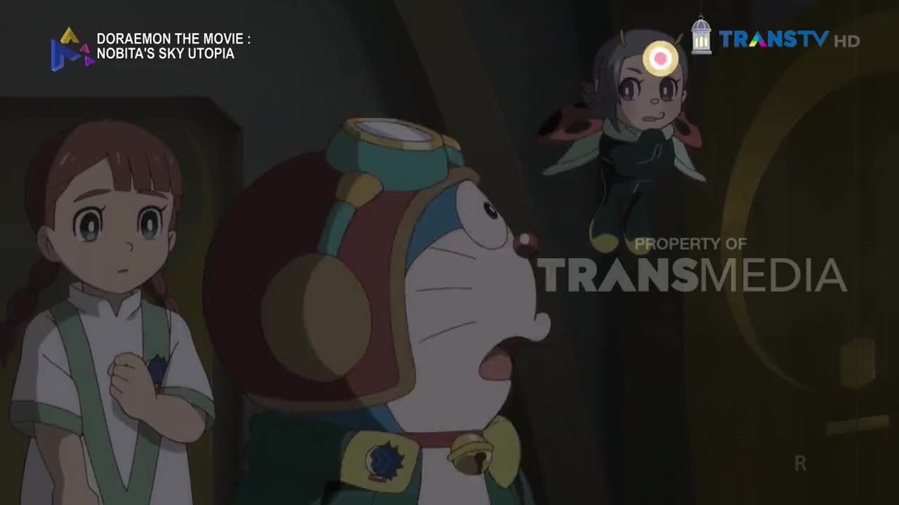 A girl with braided hair looks on with wide eyes as Doraemon, sporting a red helmet and goggles, stares upwards in surprise. A small, winged character with a ladybug pattern on its back hovers in the air above them.