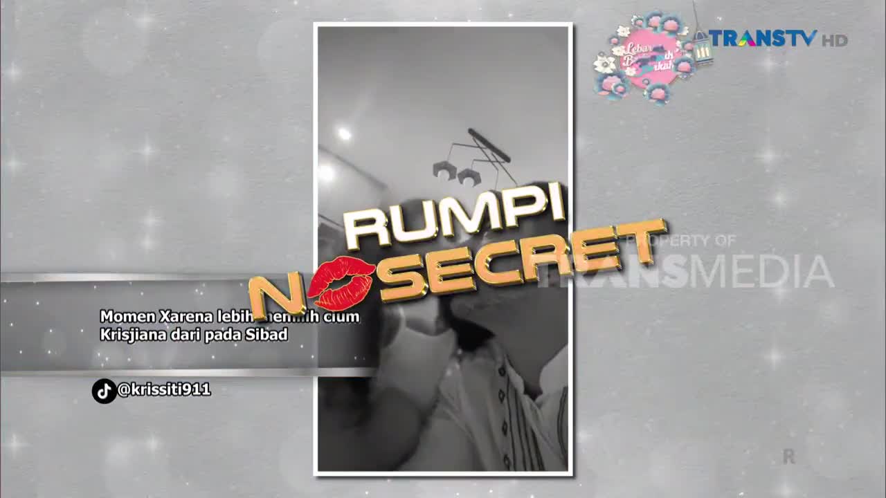 A couple leans in for a kiss, the moment captured for Trans TV's "Rumpi No Secret." The text overlay mentions "Momen Xarena lebih memilih cium Krisjiana dari pada Sibad."
