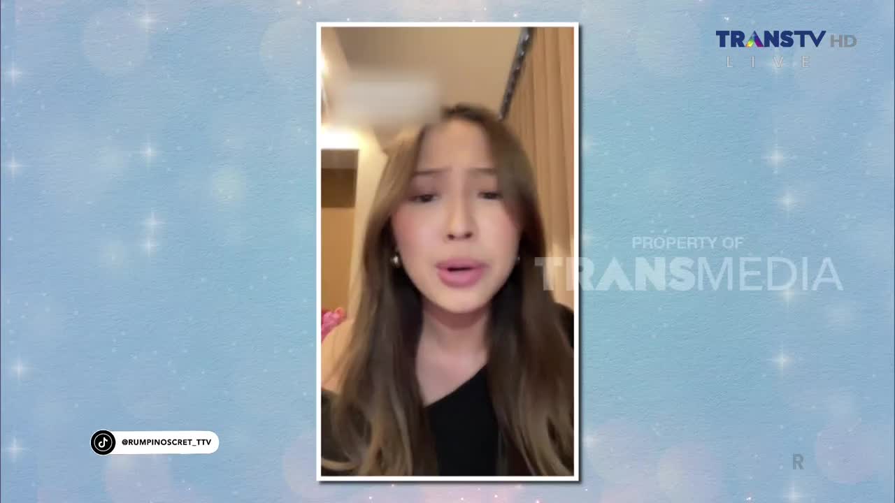 A young woman with long brown hair speaks directly to the camera, her mouth open mid-sentence. The Trans TV logo appears in the upper right corner.