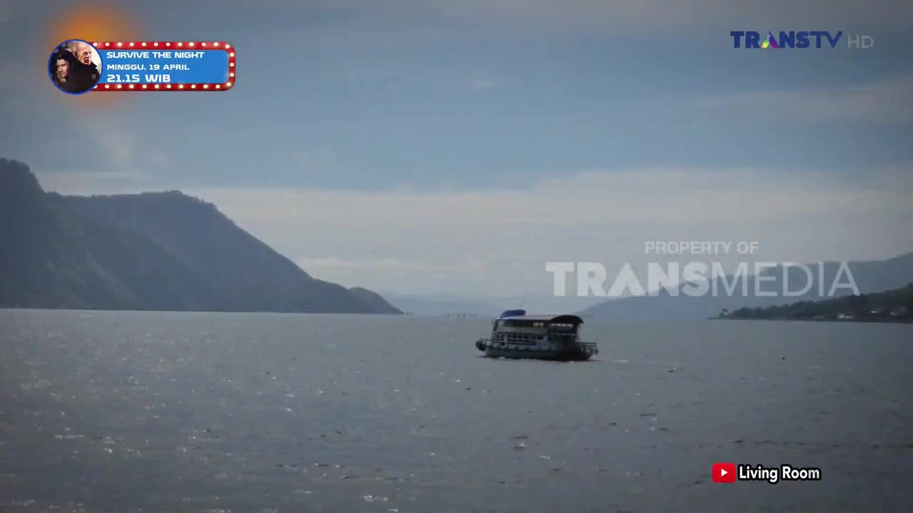 A ferry glides across the calm water, its decks visible against the misty mountains of Indonesia. The Trans TV logo is visible in the corner, marking this as a broadcast from the channel.