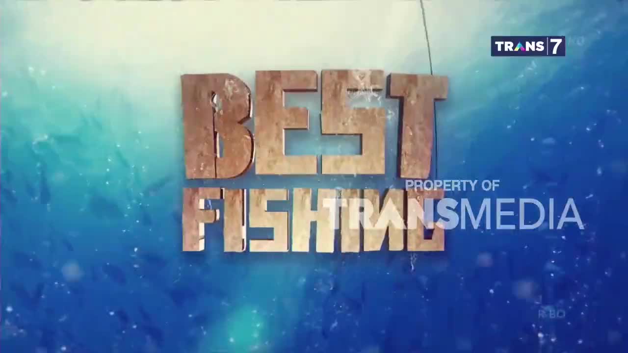 The words "BEST FISHING" appear in large, metallic letters against a shimmering blue background. A Trans7 logo is visible in the upper right corner.