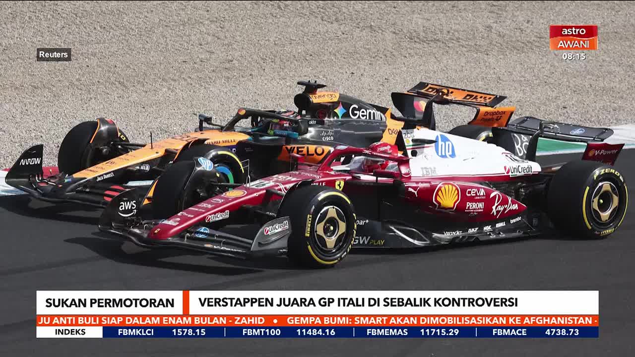 A red Ferrari and a McLaren, painted orange and black, are side-by-side on the track. The Astro Awani graphic at the bottom suggests this is coverage of a Malaysian motorsports event.
