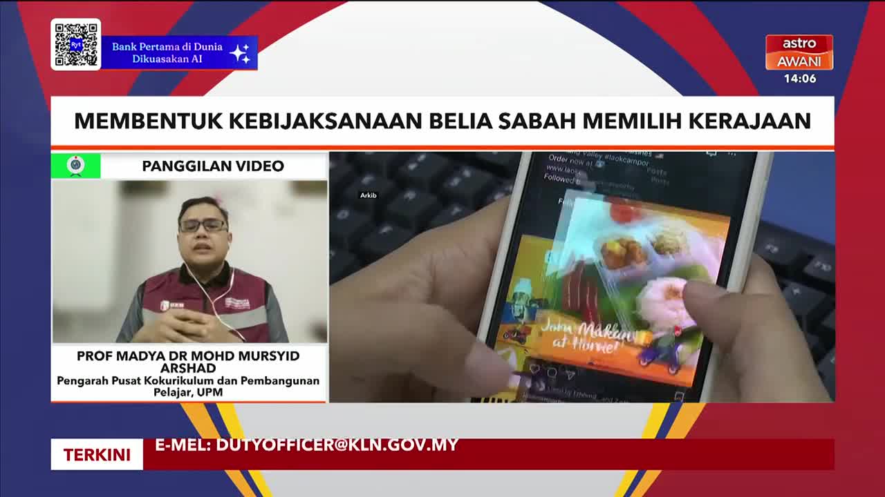 On Astro Awani, a split screen shows a man in a video call and a hand scrolling through a phone. The phone displays a colorful food post with the words "Jom Makan at Home!"
