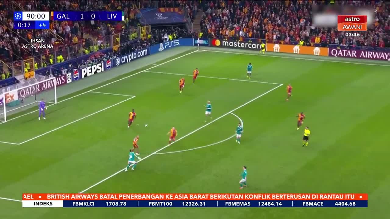 The Galatasaray players in red are pushing forward, trying to find a gap in Liverpool's defense. The clock shows 90 minutes, with just over 17 seconds of added time remaining.
