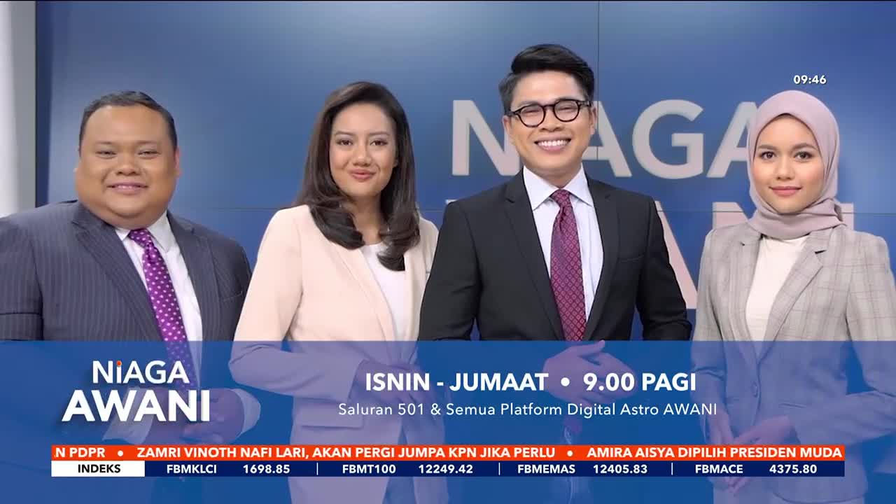 Four news anchors stand smiling behind a desk, bathed in the bright studio lights of Astro Awani. The "Niaga Awani" logo is prominently displayed at the bottom left, with scrolling text beneath it detailing current news headlines.
