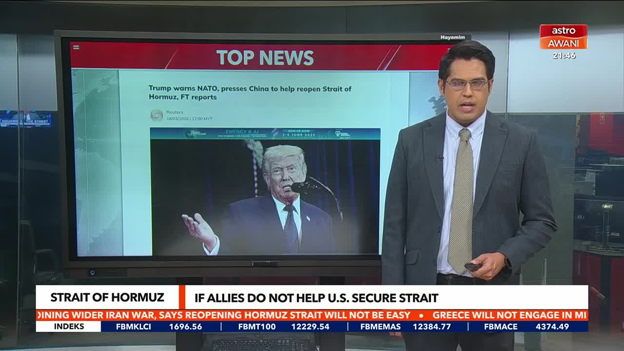 A news anchor stands in front of a large screen displaying a headline about the Strait of Hormuz and a picture of Donald Trump. The Astro Awani logo is visible in the top right corner.
