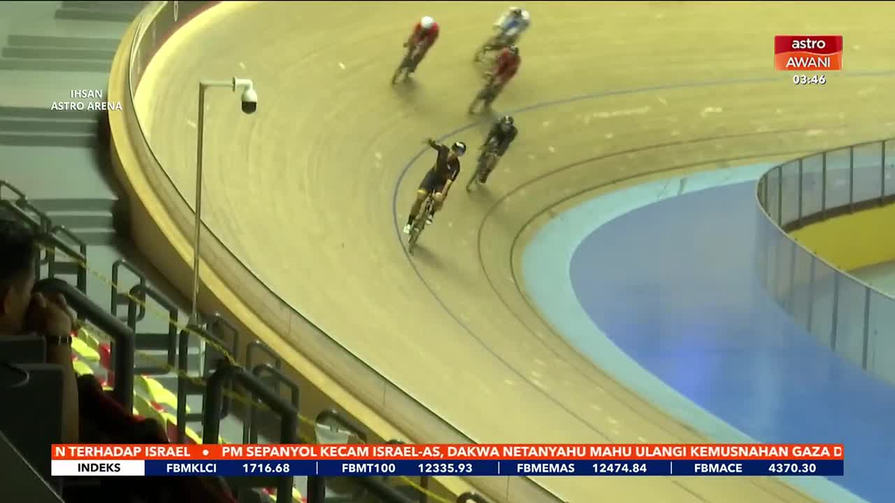 A group of cyclists are racing on a velodrome, their bikes leaning into the banked turn. The rider in the black and gold kit is pulling ahead of the others, his legs pumping hard.