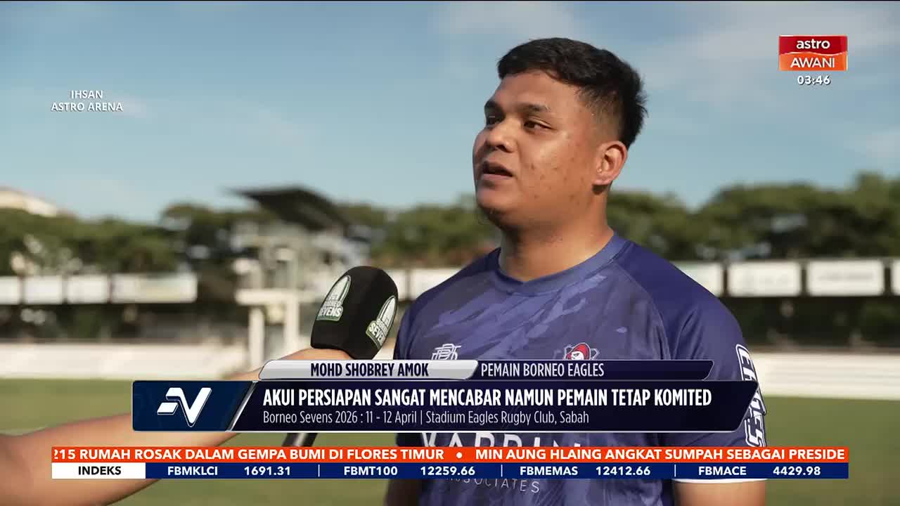 A rugby player stands on a field, a microphone held before him. The Astro Awani broadcast displays his name, Mohd Shobrey Amok, and the Borneo Eagles team.