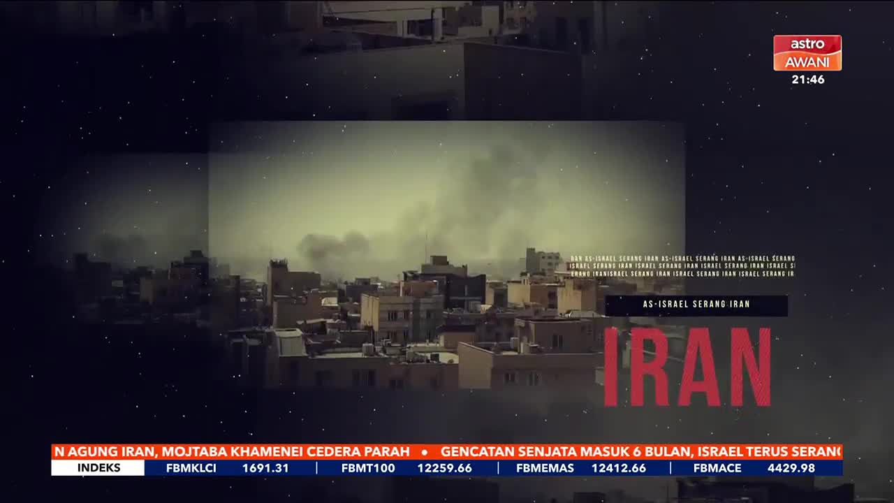 Dark smoke billows from a cluster of buildings in what looks like a city. The Astro Awani logo and the time 21:46 are visible in the upper right corner.