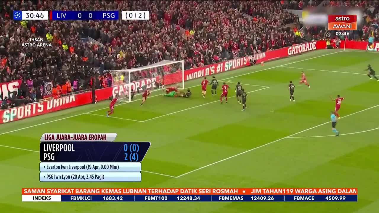 A player in red slides to block a shot as the goalkeeper dives. The score shows Liverpool 0, PSG 2, with the match clock at 30:46.