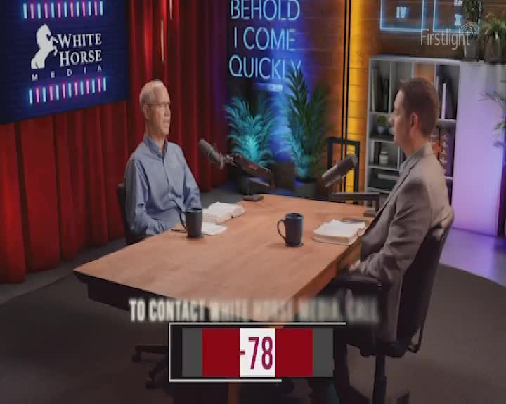 Two men sit at a table in a studio, facing each other. A screen behind one man displays "WHITE HORSE MEDIA" with a white horse logo.