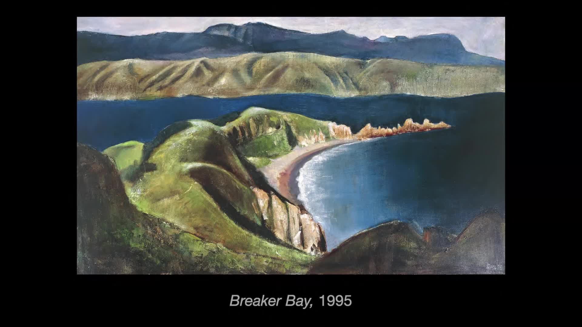The painting shows a green, rolling landscape meeting the dark blue sea. A sandy beach curves into the bay, with rocky outcrops jutting out along the shoreline.
