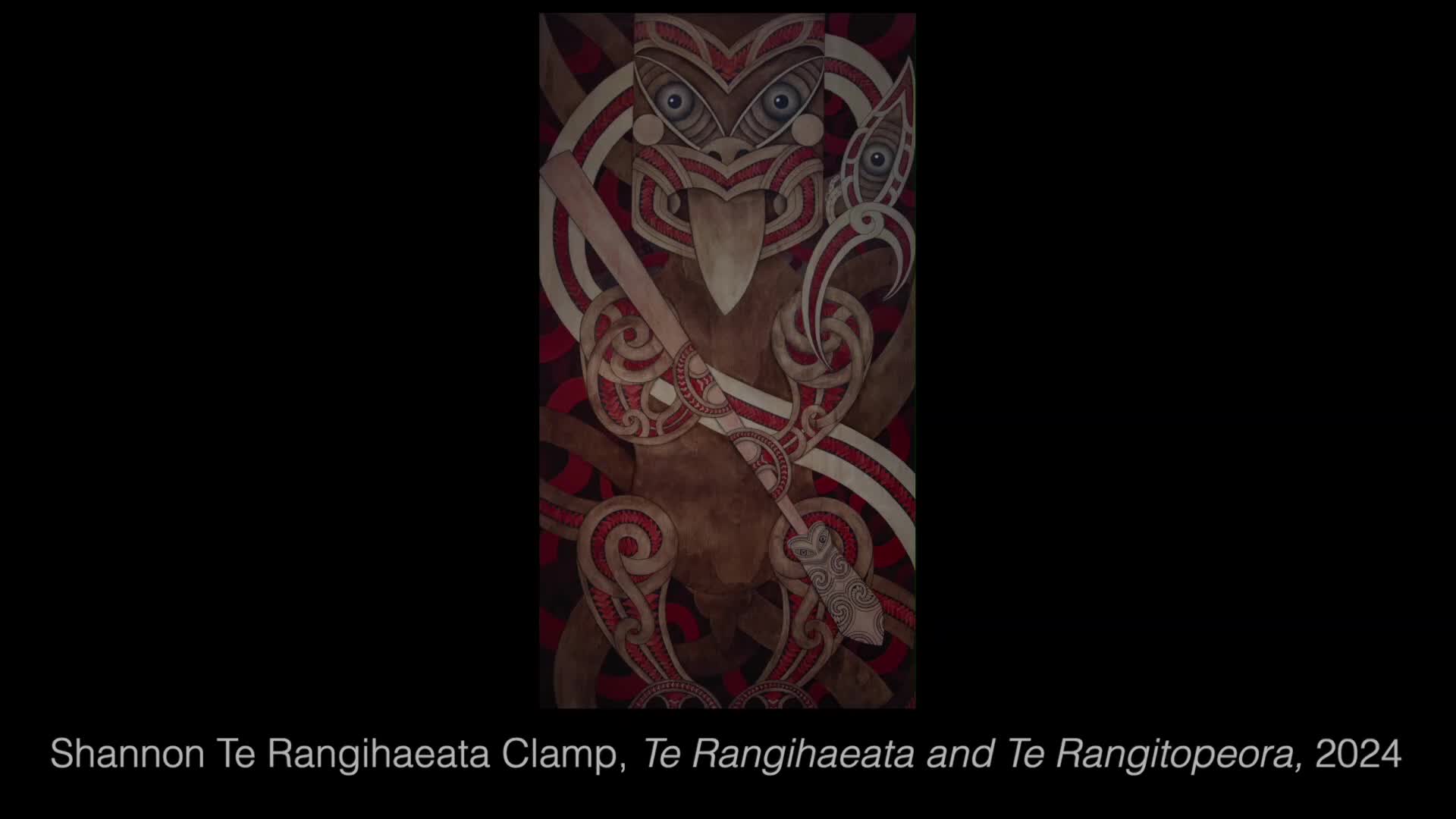 A stylized figure, rendered in browns and reds, dominates the screen. The artwork, with its intricate patterns and traditional motifs, is presented on Parliament TV.
A stylized figure, rendered in browns and reds, dominates the screen. The artwork, with its intricate patterns and traditional motifs, is presented on Parliament TV.