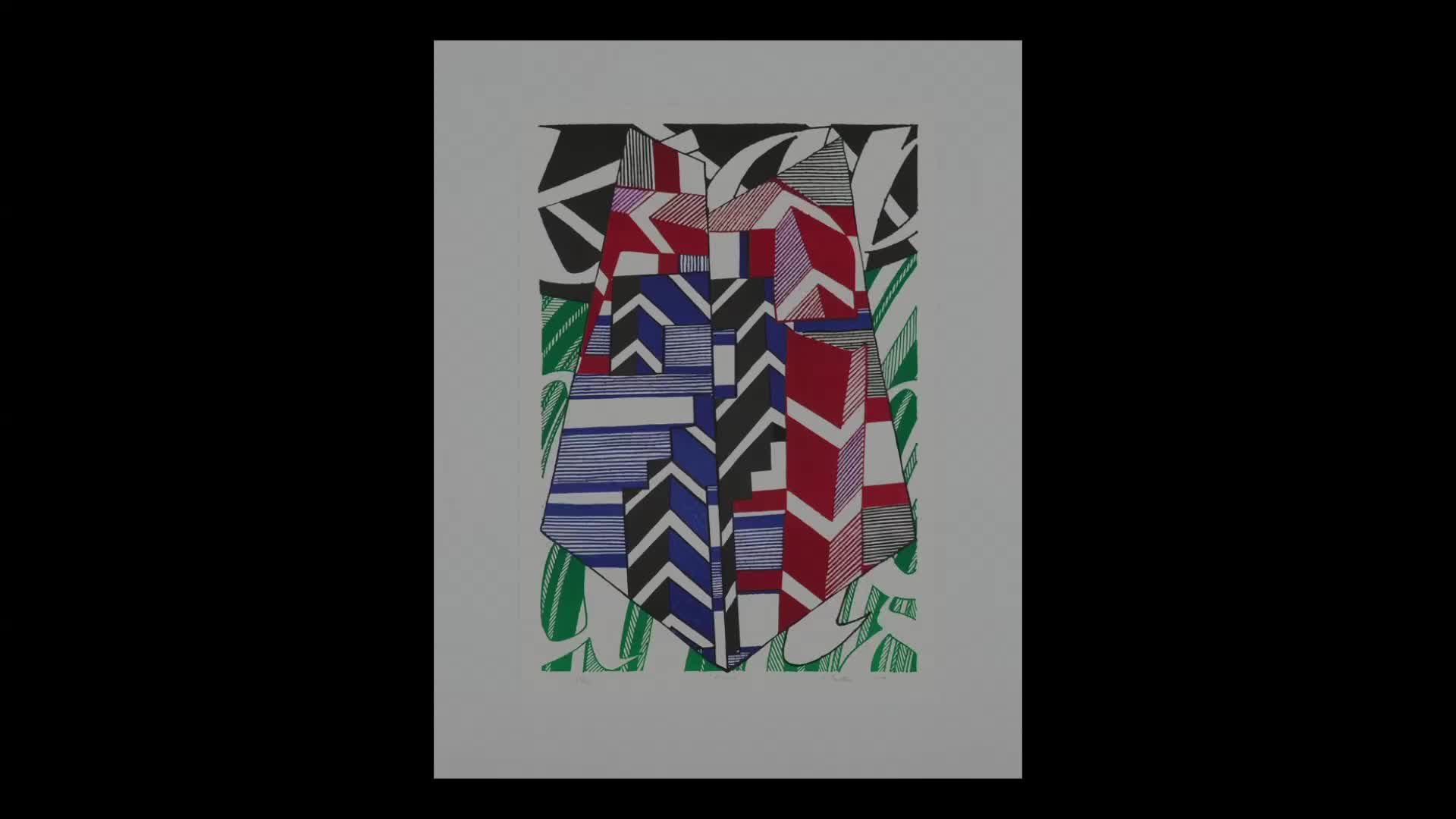 A graphic artwork of abstract shapes and patterns dominates the frame. Red, blue, and black lines form a central, shield-like design against a background of green and black elements.