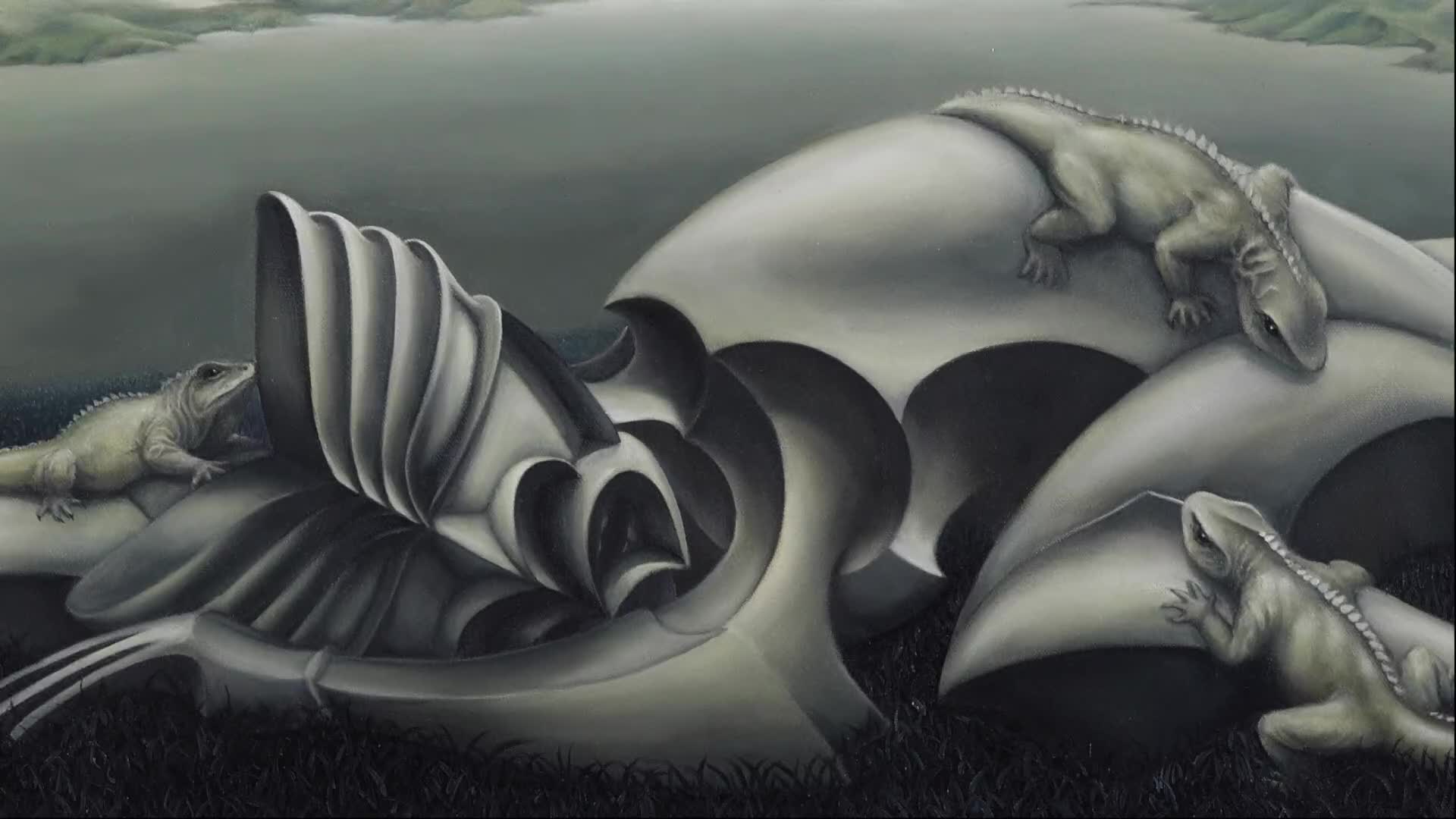 A tuatara climbs over a smooth, grey, organic structure. Another tuatara rests on a curved surface, its tail trailing.