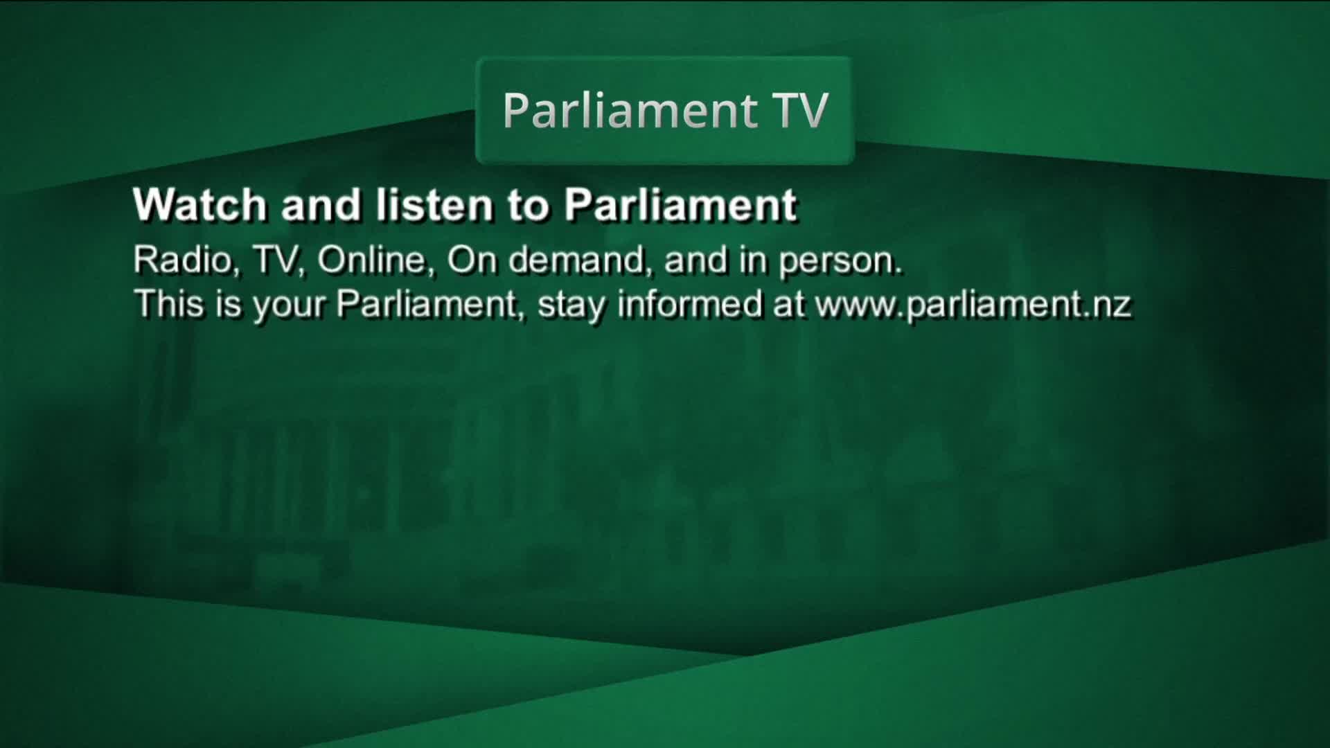 A green screen displays text about Parliament TV, with a faint outline of a building behind it. The words "Parliament TV" appear in a raised box at the top.