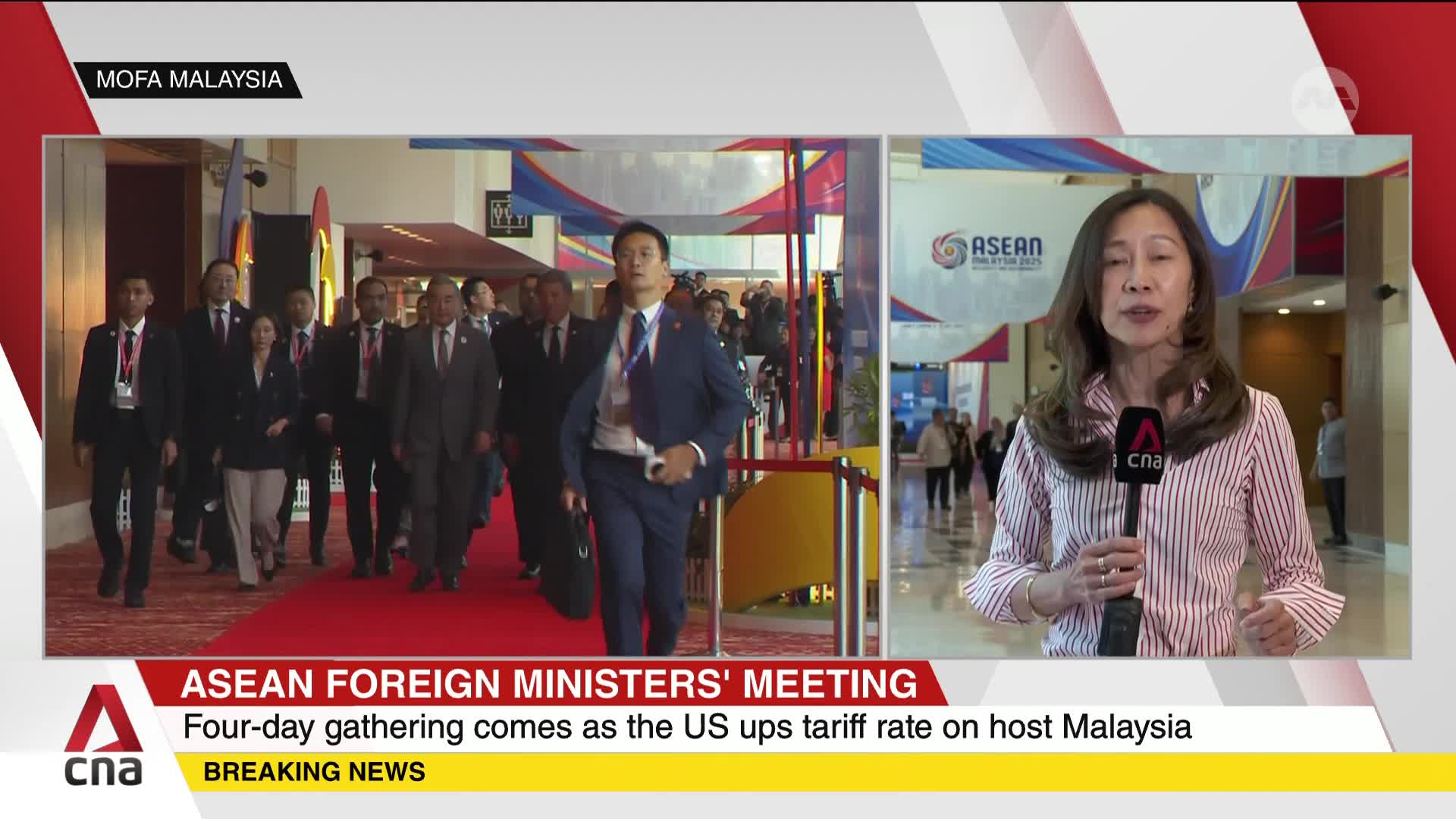A group of suited officials strides down a red carpet, heading toward a large hall as reported by CNA International. A news anchor in a striped shirt speaks directly to the camera, providing updates on the ASEAN Foreign Ministers' Meeting.
