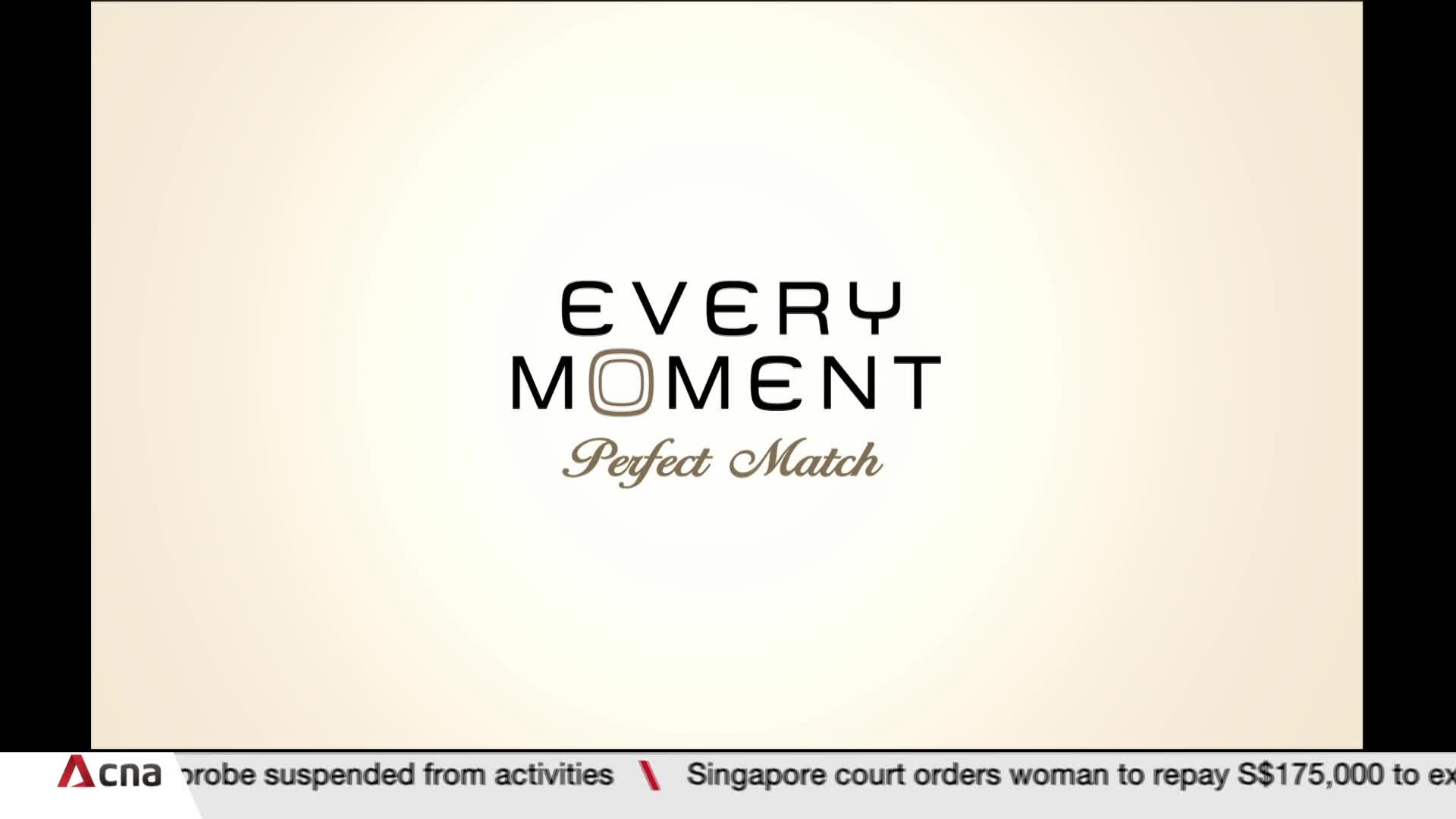 The words "Every Moment Perfect Match" are centered on a light background. Below, CNA International's news ticker scrolls with headlines from Singapore.
