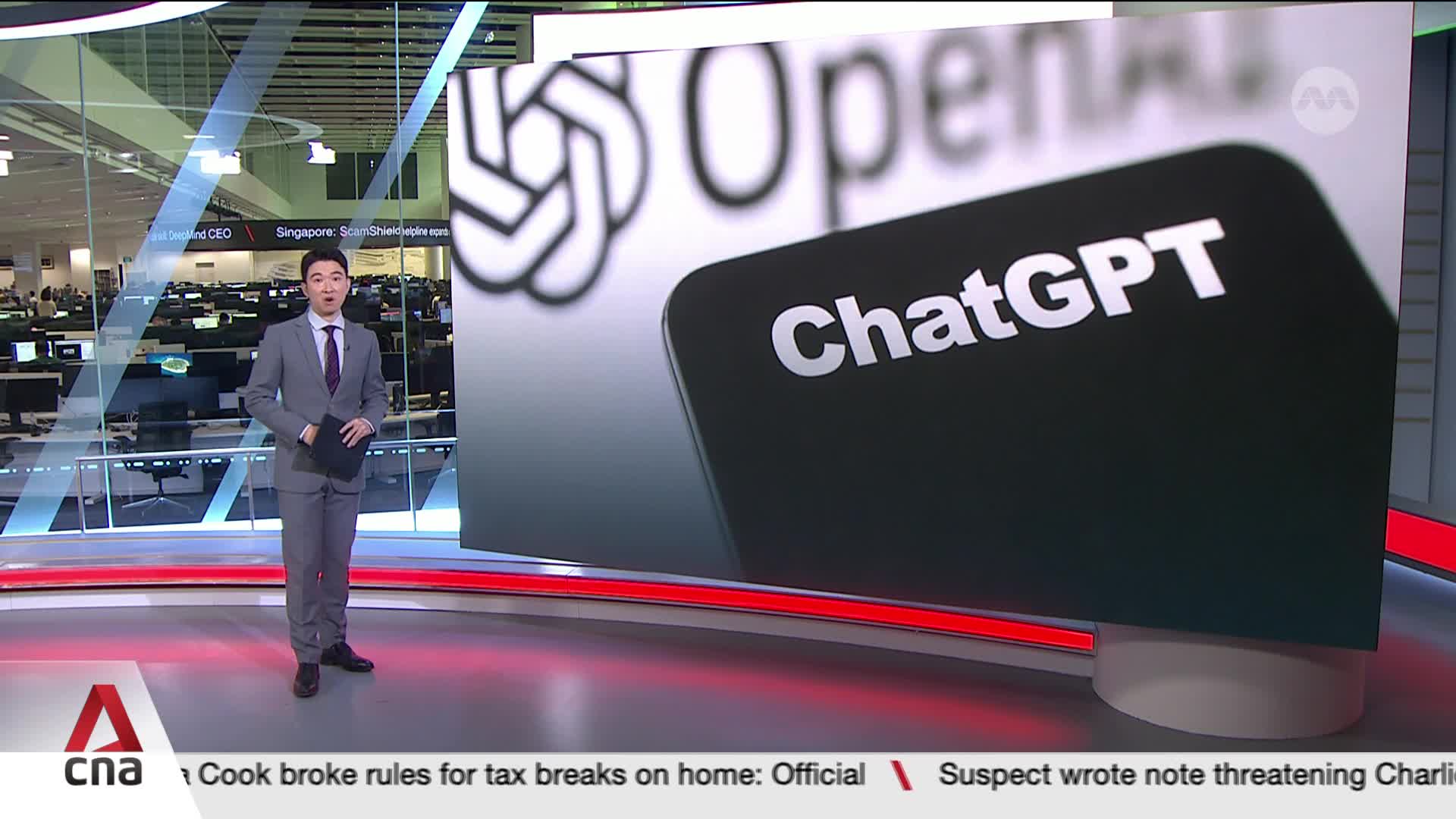 A news anchor in a gray suit stands center stage, holding a tablet, with a large screen behind him displaying "ChatGPT." The CNA International logo is visible at the bottom of the screen.
