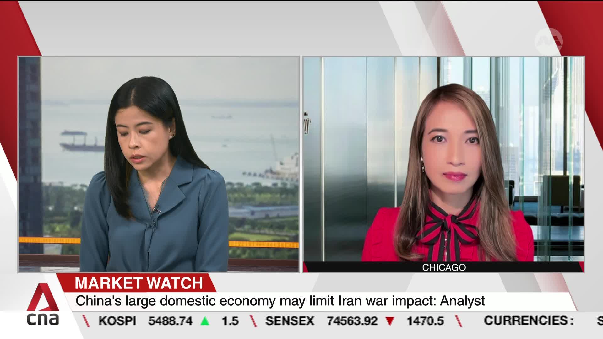 A woman in a blue blouse looks down, her gaze fixed on something just out of frame. Across the screen, a woman in a red jacket speaks directly to the camera, her backdrop a modern office space. A woman in a blue blouse looks down, her gaze fixed on something just out of frame. Across the screen, a woman in a red jacket speaks directly to the camera, her backdrop a modern office space.