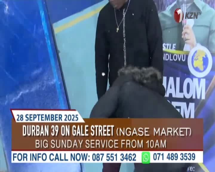 A man in a black coat is bent over, while another man stands nearby. The 1KZN TV logo is visible, along with the details for a Sunday service in Durban.
