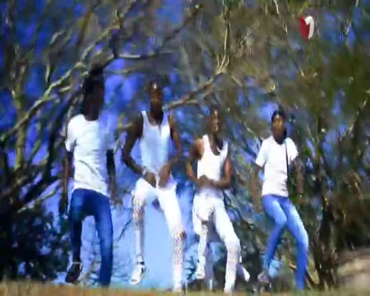 Four young men are dancing in front of a backdrop of trees, their movements energetic. The 1KZN TV logo appears in the corner of the screen. Four young men are dancing in front of a backdrop of trees, their movements energetic. The 1KZN TV logo appears in the corner of the screen.