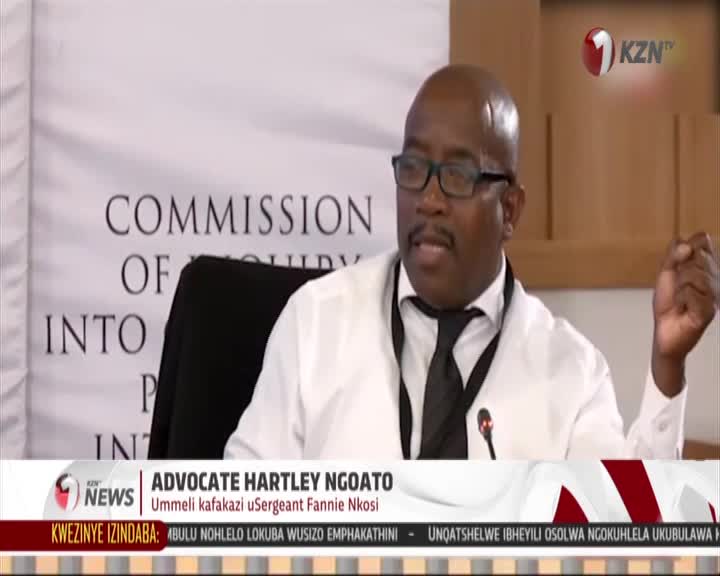 Advocate Hartley Ngoato speaks at a commission hearing, his right hand gesturing as he addresses the room. The KZN TV logo appears in the upper right corner. Advocate Hartley Ngoato speaks at a commission hearing, his right hand gesturing as he addresses the room. The KZN TV logo appears in the upper right corner.