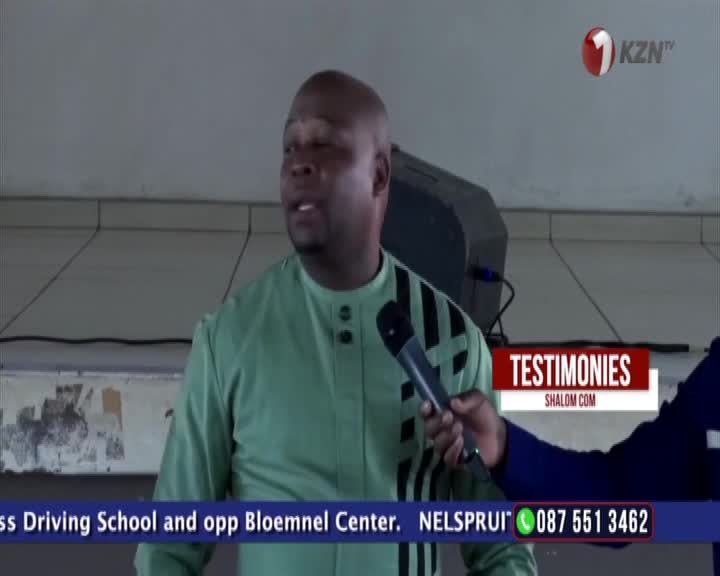 A man in a light green shirt is speaking into a microphone. A 1KZN TV logo is visible in the corner.