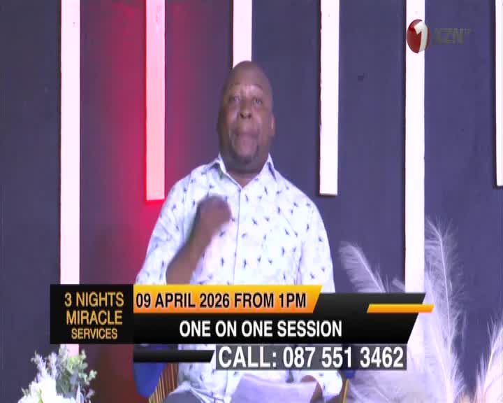 A man in a patterned shirt gestures with his right hand while speaking. The 1KZN TV logo appears in the upper right corner.