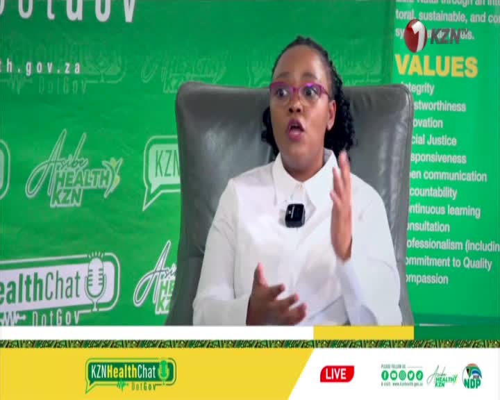 A woman in a white shirt speaks animatedly, her hands gesturing. The KZN HealthChat logo and "DotGov" are visible behind her.