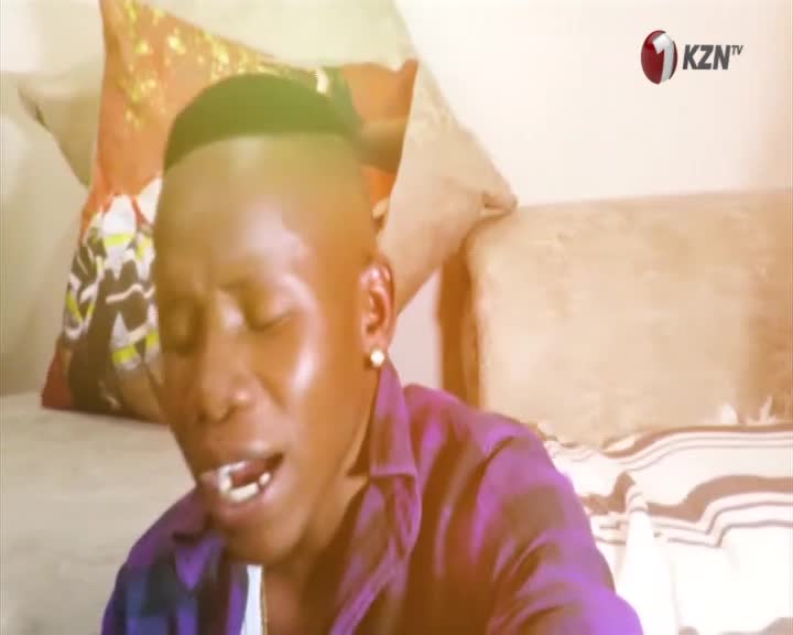 A young man with a fresh haircut leans forward, his mouth open as if singing or speaking passionately. The KZN TV logo appears in the corner, hinting at a broadcast from KwaZulu-Natal.