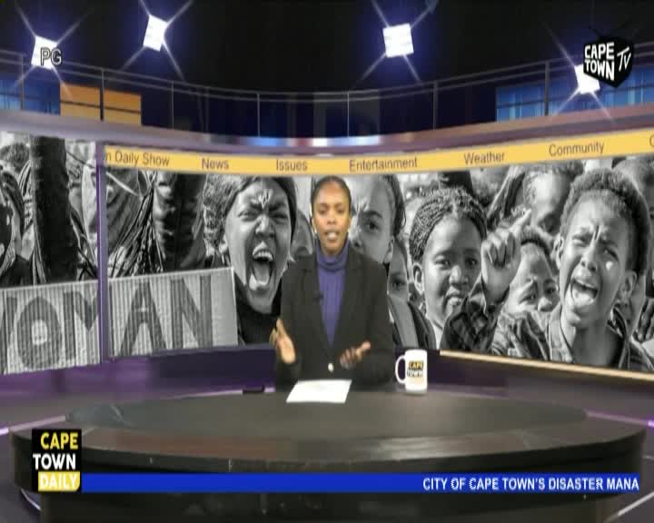 A news anchor on Cape Town TV gestures towards a backdrop of black-and-white images, including a crowd of people with open mouths. The Cape Town Daily show is reporting on the City of Cape Town's disaster.
