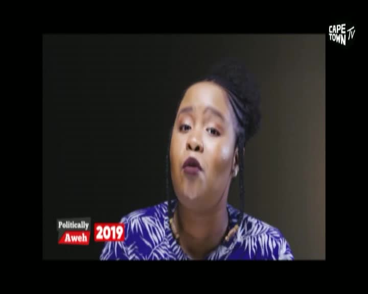 A woman on Cape Town TV is speaking, her lips moving as she addresses the camera. The "Politically Aweh 2019" graphic sits in the corner of the screen.
